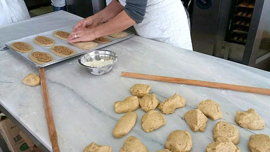 woman making bread at The Apolloniatisses workshop